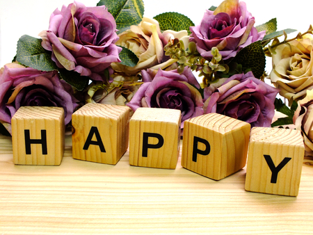 lettering happy  with artificial roses flowers bouquetの写真素材