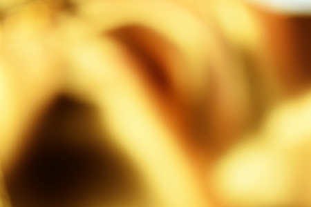 golden color abstract background with blurred defocus bokeh light for templateの写真素材