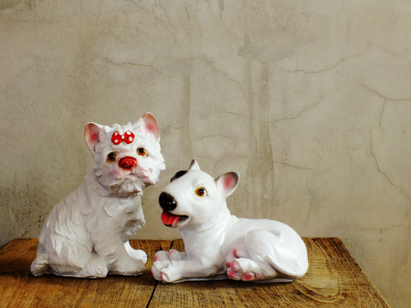 dog statue ceramic with space copy on wooden backgroundの写真素材