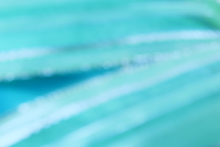 light blue color abstract background with blurred defocus bokeh light for templateの写真素材