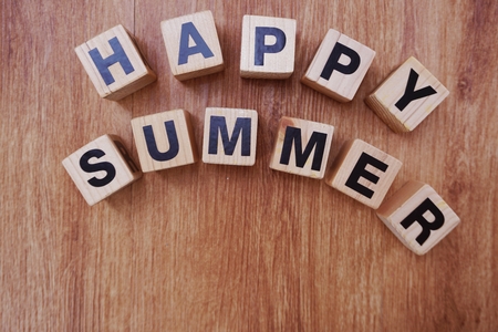 happy summer alphabet on wooden backgroundの写真素材