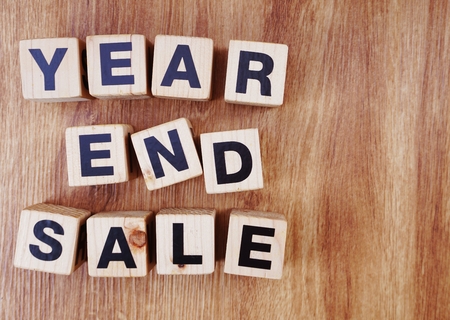 year end sale text alphabet letters on wooden backgroundの写真素材