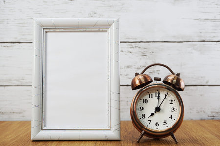 vintage alarm clock and space photo frameの写真素材