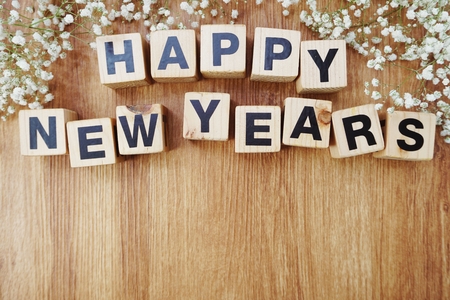 happy new years alphabet letters on wooden backgroundの写真素材