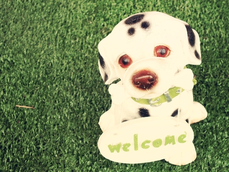ceramic dog with welcome signの写真素材
