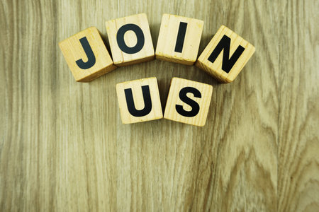 join us alphabet top view on wooden background