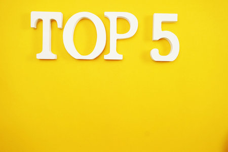 top five letters alphabet with space copy on yellow background
