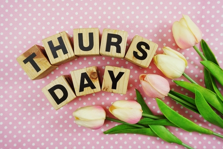 thursday alphabet letter with space copy on pink polka dot backgroundの写真素材