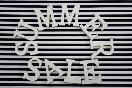 summer sale with star fish on blue and white stripe backgroundの写真素材