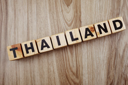 Thailand word letters alphabet on wooden backgroundの写真素材