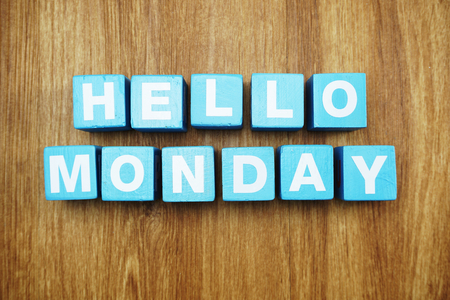 hello monday with blue wooden cubes alphabet letter on wooden backgroundの写真素材