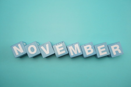 November alphabet letters on blue backgroundの写真素材
