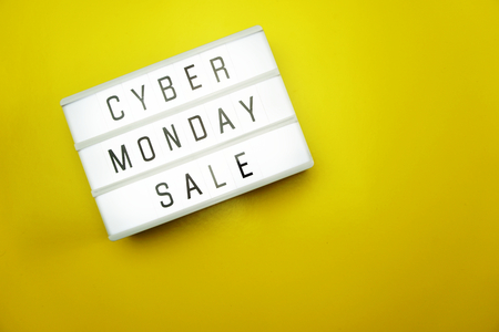 cyber monday sale flat lay top view on yellow backgroundの写真素材
