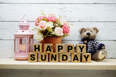 Happy Sunday wooden letter alphabet with decorate item on wooden backgroundの写真素材