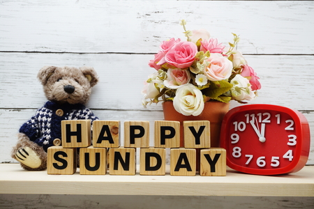 Happy Sunday wooden letter alphabet with decorate item on wooden backgroundの写真素材