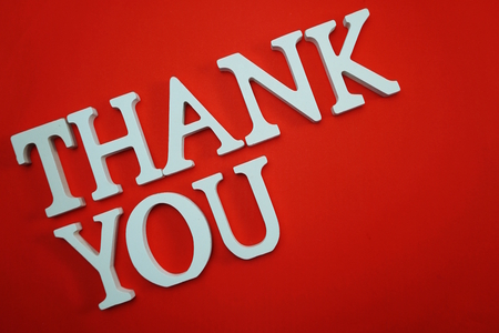 Thank You alphabet letters on red backgroundの写真素材