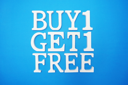 Buy one Get one Free Sale Promotion on blue backgroundの写真素材