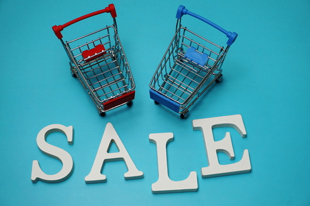 Sale and Mini Trolley Cart on blue backgroundの写真素材