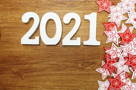2021 happy new year with whit and red star ornament decoration on wooden backgroundの写真素材