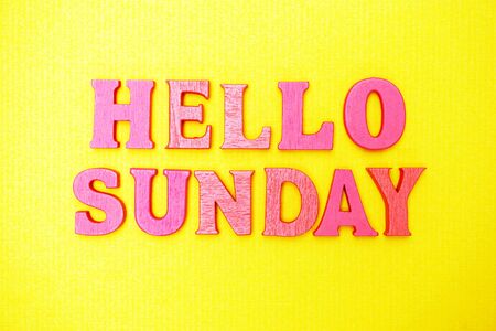Hello Sunday alphabet letters on yellow backgroundの写真素材