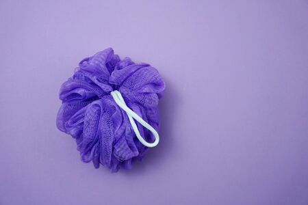 Purple bath soft with rope on Purple backgroundの写真素材