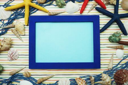Mock up flat lay space photo frame with nautical marine decorationの写真素材