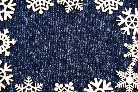 Christmas frame of snowflakes on Knitted background textureの写真素材