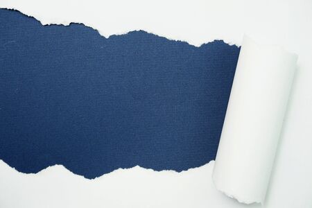 Paper torn with space copy on blue backgroundの写真素材