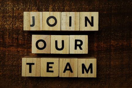 Join Our Team text message on wooden backgroundの写真素材