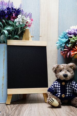 Space wooden easel black with space copy on wooden backgroundの写真素材