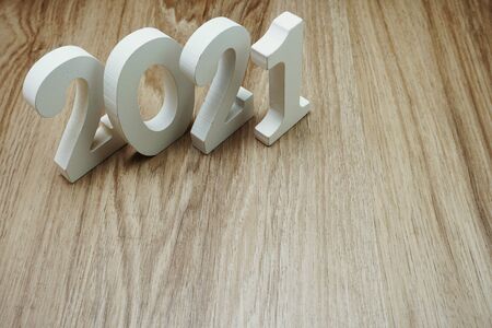 2021 Happy New Year with space copy on wooden backgroundの写真素材