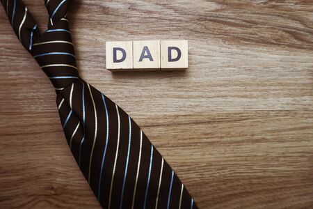 Happy Father's Day concept with DAD alphabet letter with space copy on wooden backgroundの写真素材
