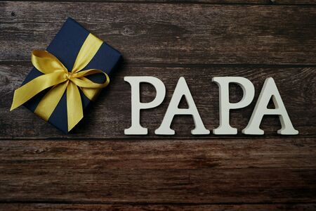 PAPA alphabet letter on wooden backgroundの写真素材