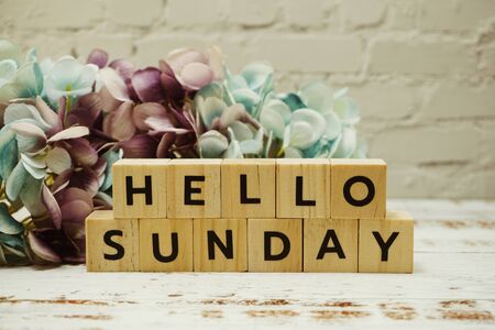 Hello Sunday alphabet letter on wooden backgroundの写真素材