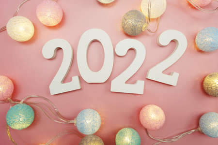 Happy New Year 2022 festive background with space on pink backgroundの写真素材