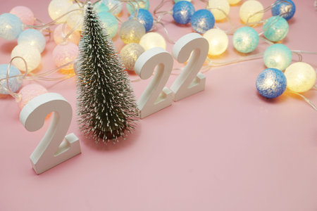 Happy New Year 2022 festive background with space on pink background