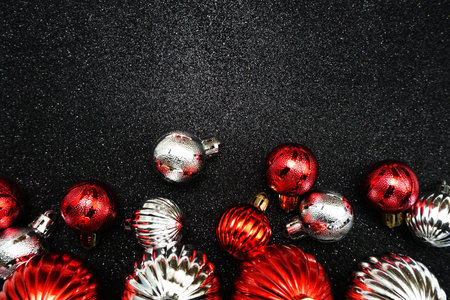 Christmas balls composition with space copy on Black glitter backgroundの写真素材