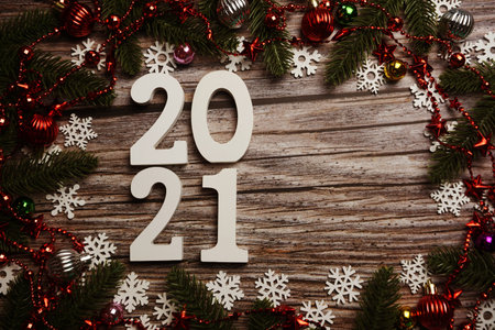 2021 Happy New Year and Christmas decoration on wooden background