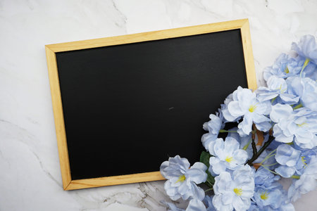 Mock-up flat lay Black board and flower bouquet decorationの写真素材