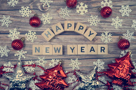 Happy New Year alphabet letter with christmas accessories on wooden backgroundの写真素材
