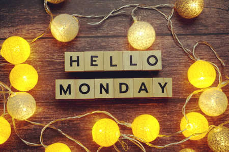 Hello Monday alphabet letter with LED cotton balls on wooden backgroundの写真素材