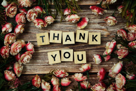 Thank You alphabet letter with Blooming flower on pink backgroundの写真素材