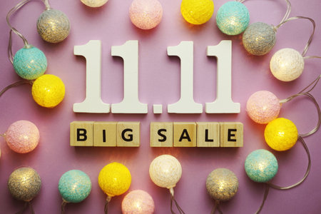 11.11 Big Sale alphabet letter with LED cotton balls on purple backgroundの写真素材