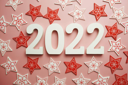 Happy New Year 2022 alphabet letter with Christmas decoration on pink background