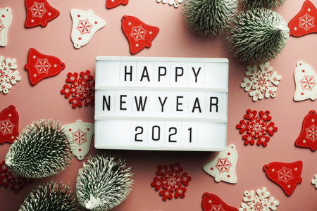 Happy New Year 2021 word in light box on pink backgroundの写真素材