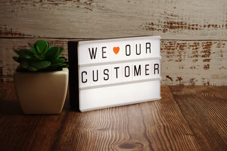We love our customer word in light box business concept background