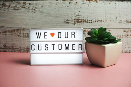 We love our customer word in light box business concept backgroundの写真素材