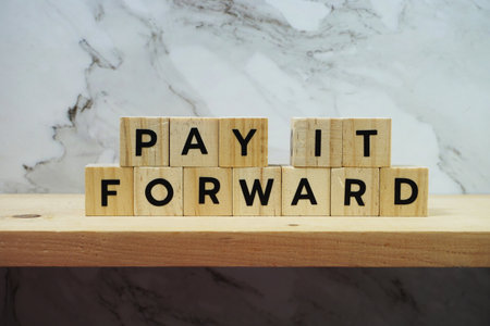 Pay It Forward alphabet letter on marble and wooden shelves backgroundの写真素材