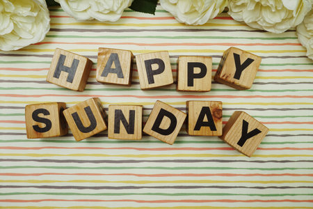 Happy Sunday alphabet letters on colorful stripes background