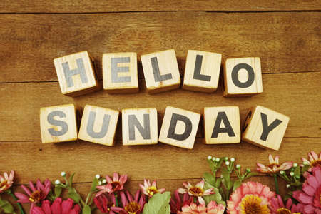 Hello Sunday alphabet letters on wooden backgroundの写真素材